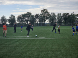 Laatste training S.K.N.W.K. JO10-1 (partijtje tegen de ouders) van woensdag 22 mei 2024 (16/133)